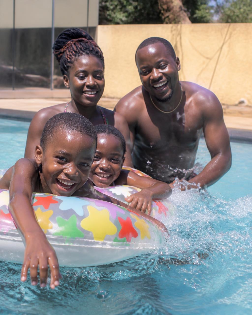 Friends laughing by the pool